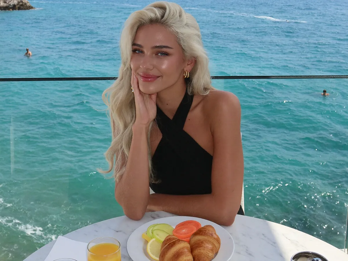 Sunny seaside terrace breakfast (illustrative)